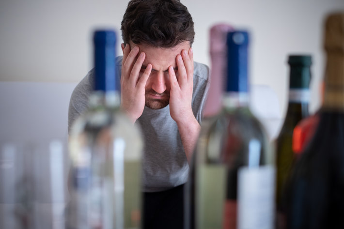 Alcohol addicted man alone having memory problems