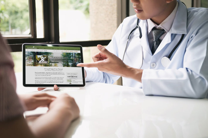Doctor showing Narconon website to a patient.