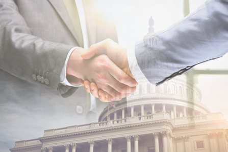 Lobbyist and congressman shaking hands. 