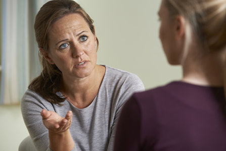 Worried Parent Talking with Daughter