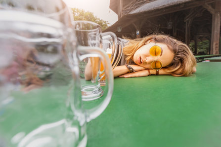 Young drunk girl with hangover sleeping