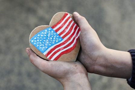 Holding heart with us flag