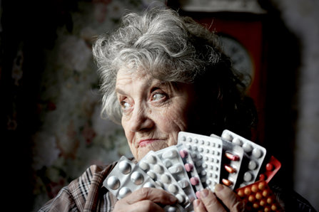 Old lady with pills