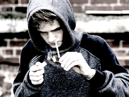 Young boy smoking marijuana