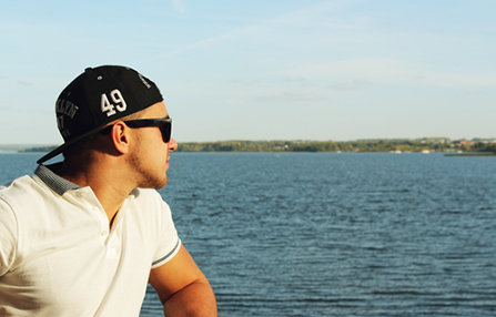 Young man looking at the lake