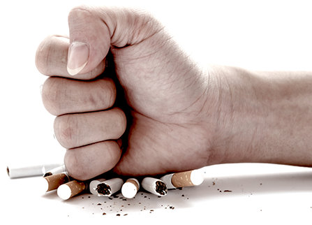 Fist crashing cigarettes