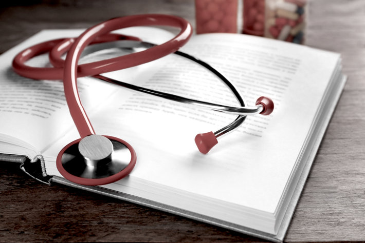 Medical education—book and stethoscope.