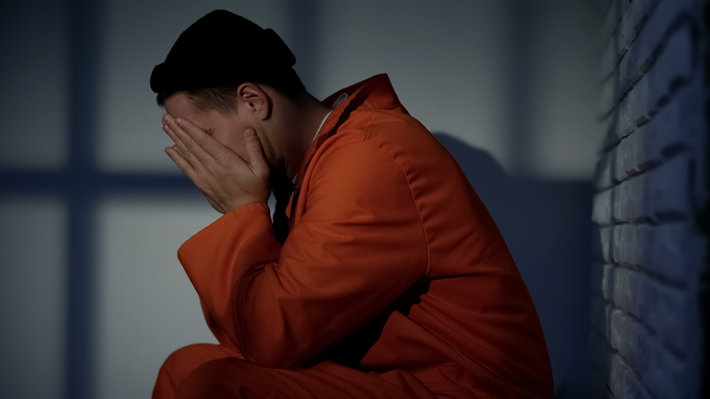 Depressed man in a jail